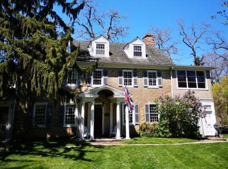 The south-facing front facade of Nelles Manor, a Georgian stone-and-frame heritage house museum in Grimsby, Ontario, its central stone section dating to 1798.