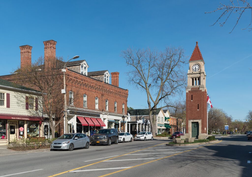 Queen Street in Niagara-on-the-Lake with heritage brick shopfronts and the clock tower