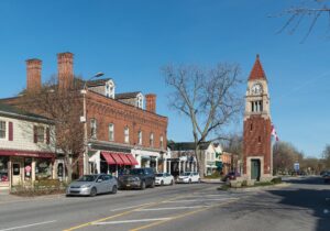 Queen Street in Old Town Niagara-on-the-Lake, with heritage brick shopfronts and the Cenotaph clock tower