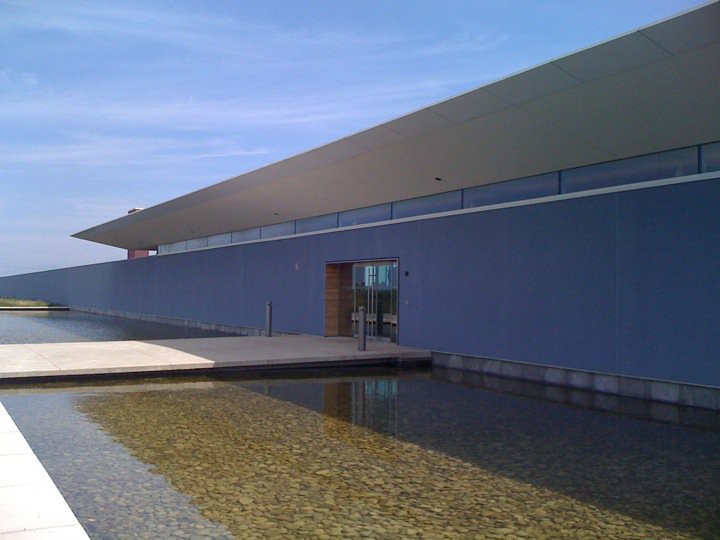 Southbrook Vineyards, the certified organic and biodynamic winery on Niagara Stone Road in Niagara-on-the-Lake, Ontario, seen from outside on a clear summer day.