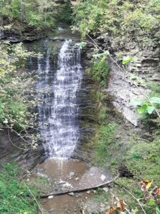 Swayze Falls cascading over layered rock amid green forest at Short Hills Provincial Park, near the St. Johns hamlet in the Town of Pelham, Niagara Region, Ontario.